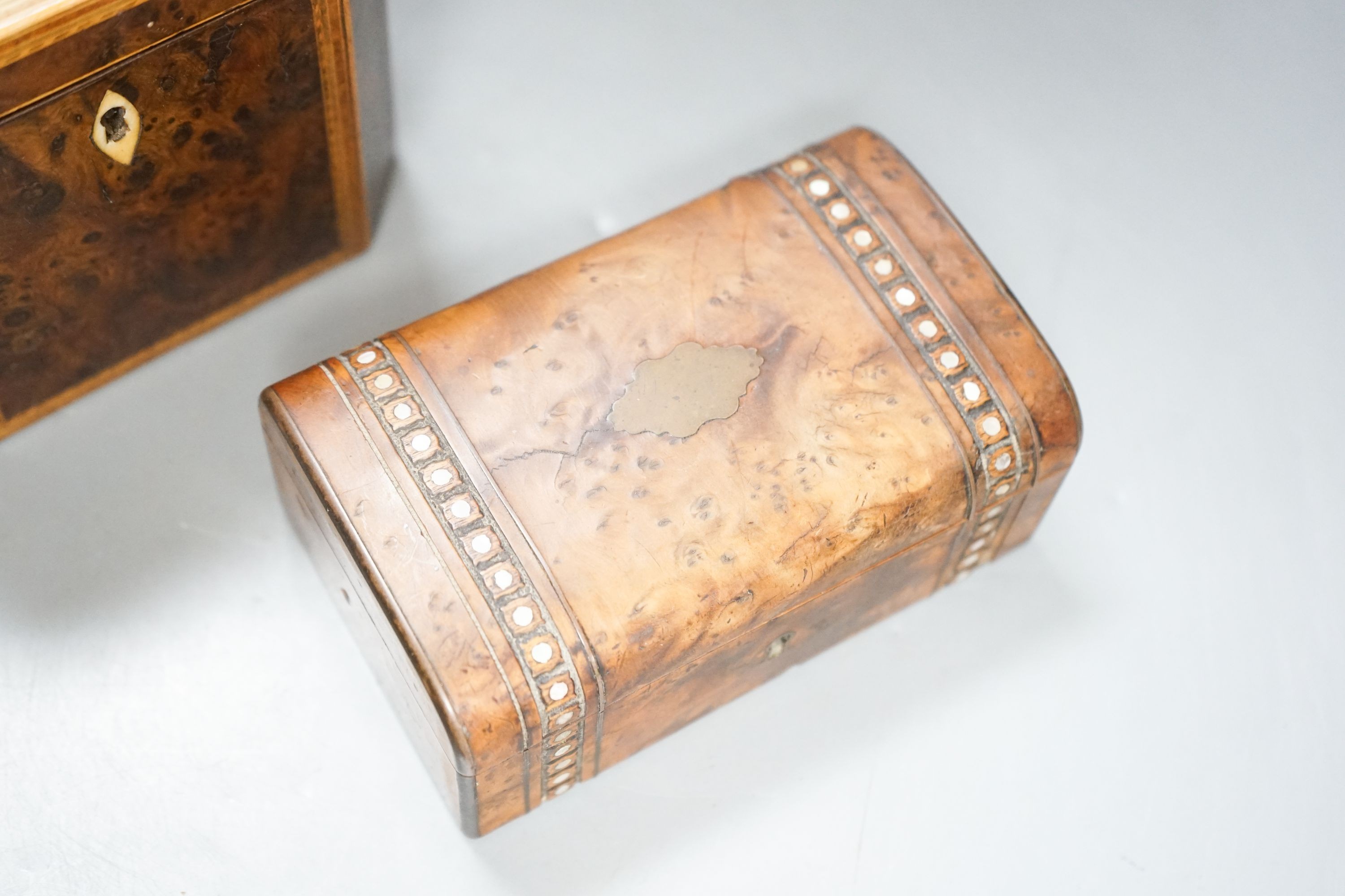 A George III burr yew and harewood, tulipwood and boxwood strung tea caddy, of octagonal form, 12.5cm and a small French yew jewellery casket
